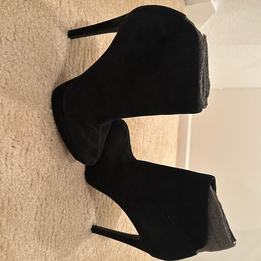 Brand new black booties for women in a size 10.5